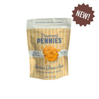 A stand-up pouch of Piedmont Pennies Bourbon Brown Sugar Baked Biscuit Bites on a white background, featuring a brown starburst 'NEW!' sticker in the top right corner.