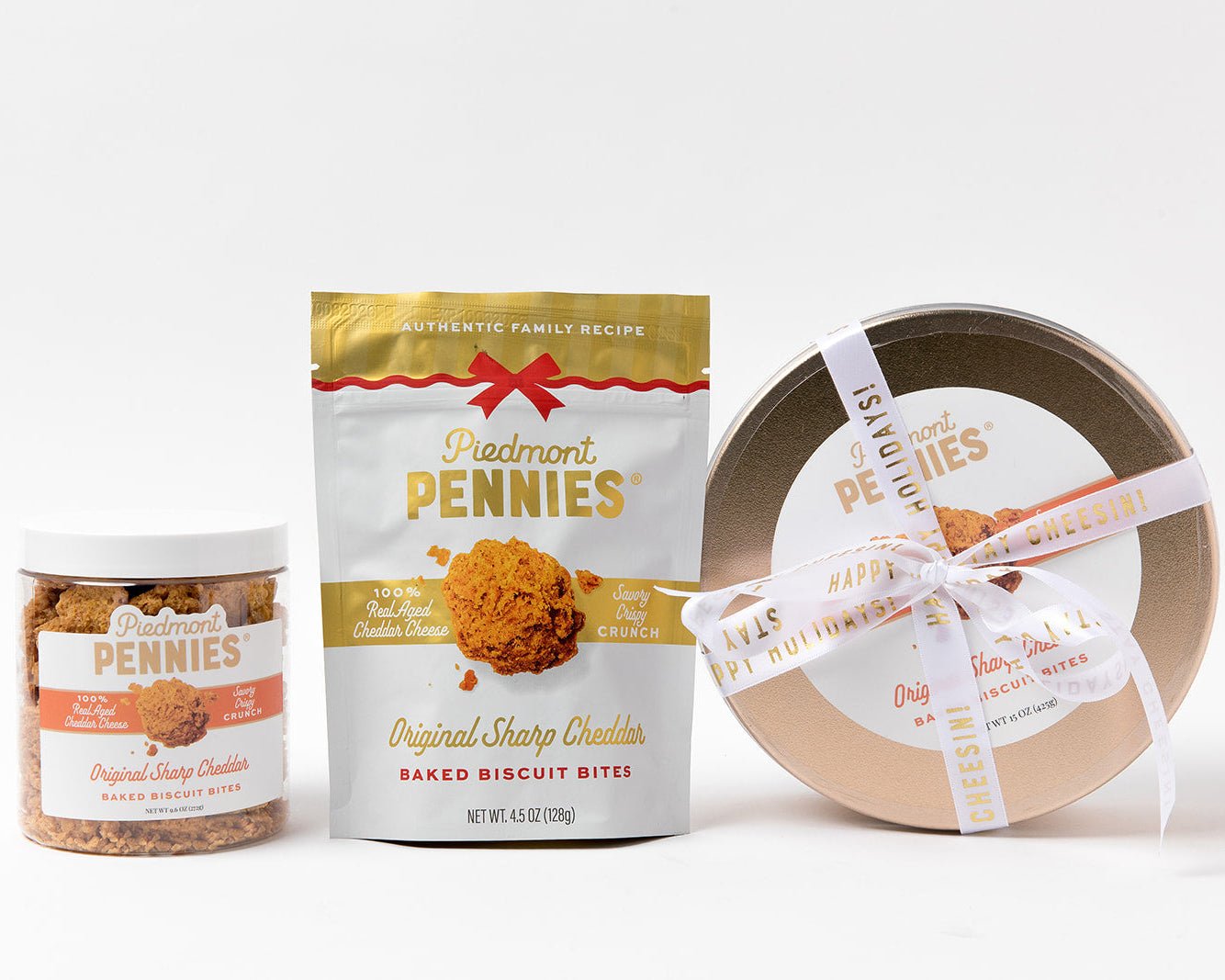 Holiday packaging 2025 of piedmont pennies including a Big Penny Gold Tin, jar, and pouch